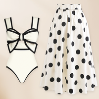 Swimsuit and polka dot skirt